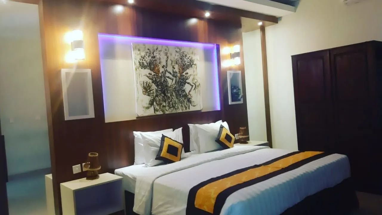 Bedroom with a custom headboard wall and side tables