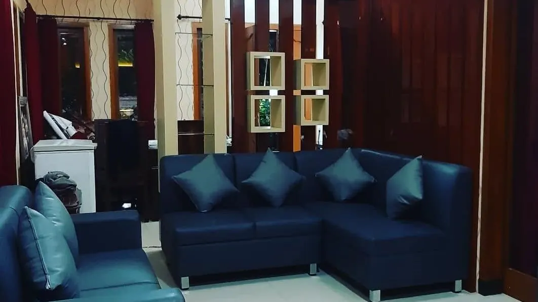 Living room with a custom TV wall and built-in lighting