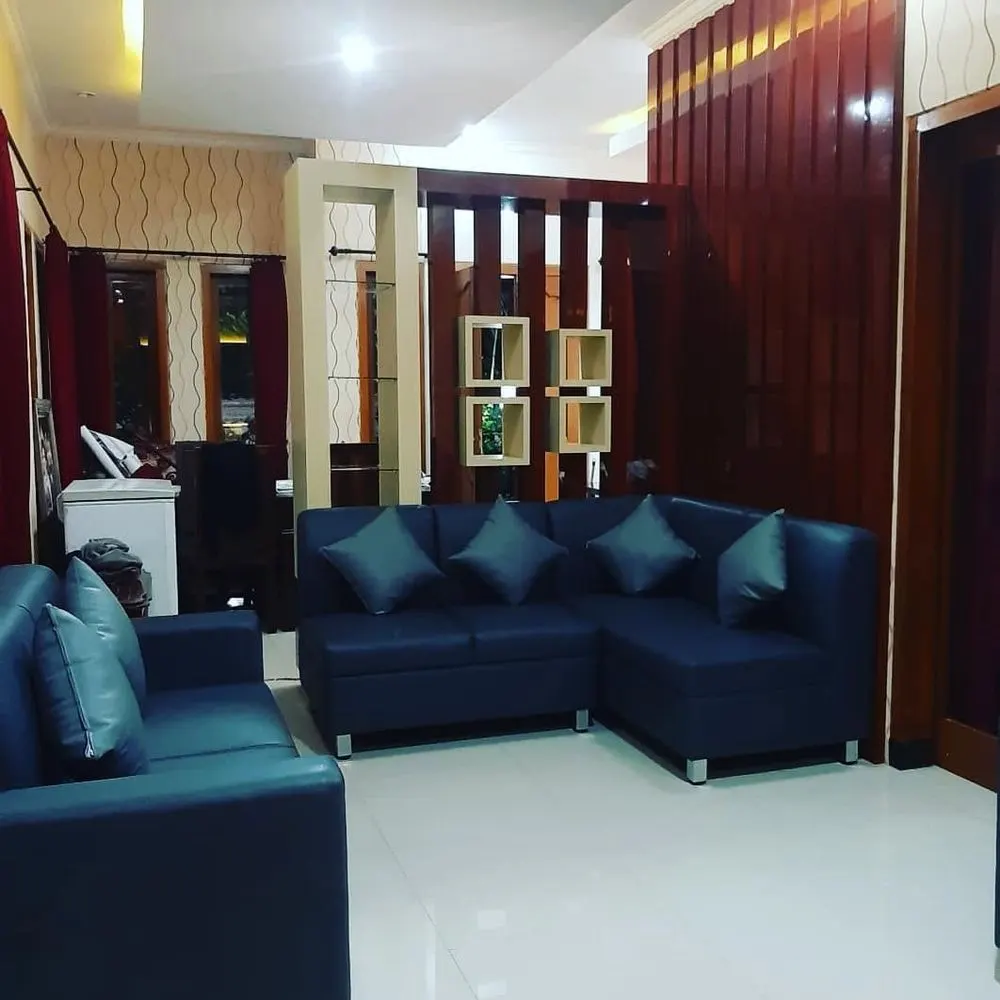 Living room with a custom TV wall and built-in lighting