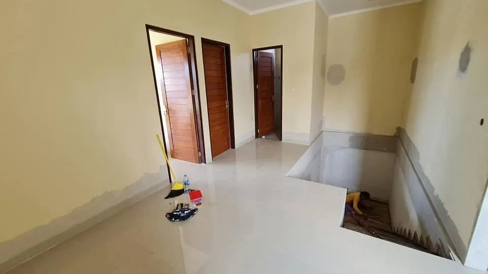 Finished corridor with tiled floor and timber doors